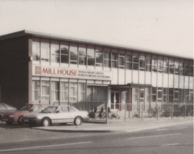 Old Mill House Building with cars parked outside